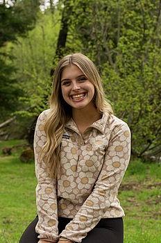 Young woman in front of green background